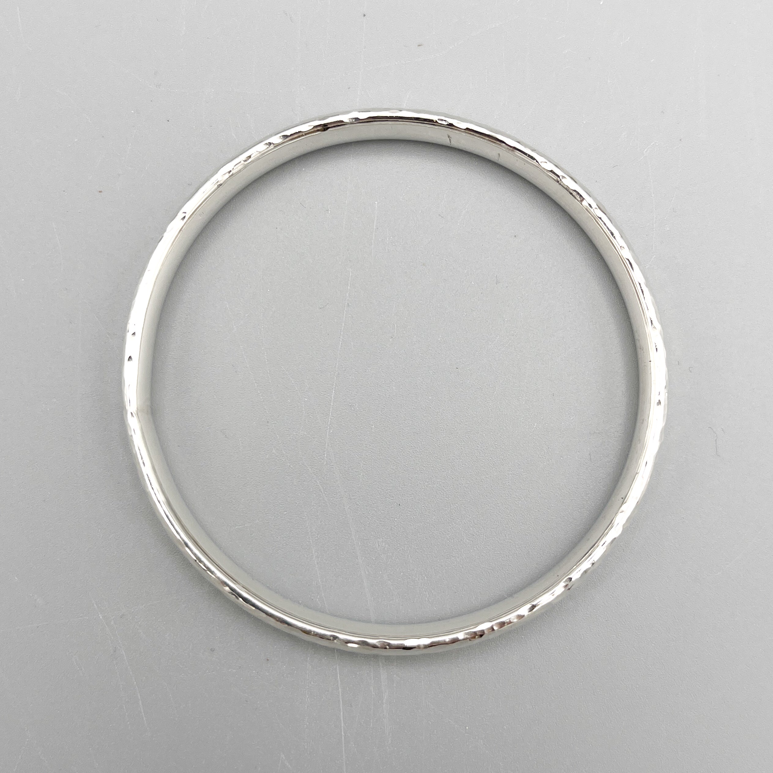 Sterling Silver Bangle, oval design with a hammered finish