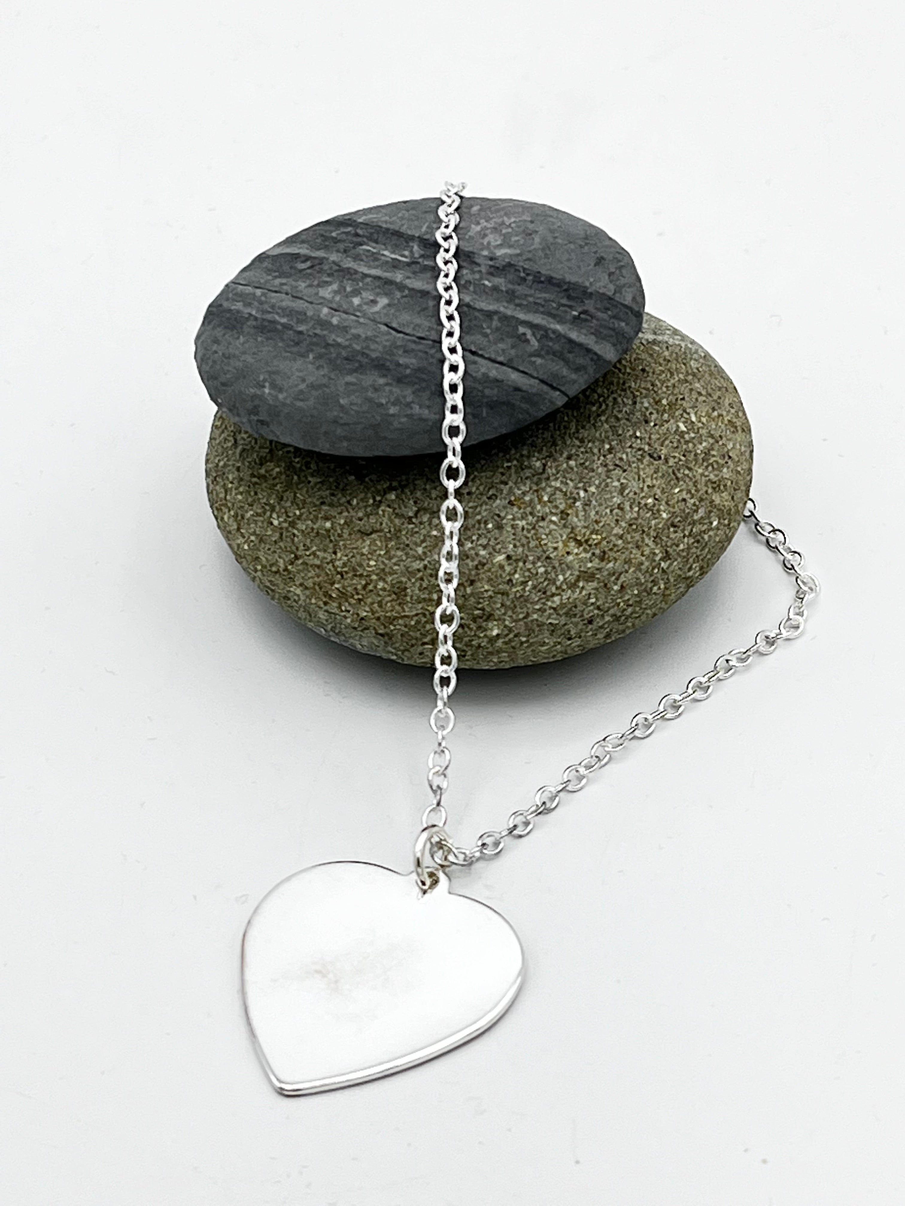Single heart pendant 25mm wide hammered finish on 16" trace chain