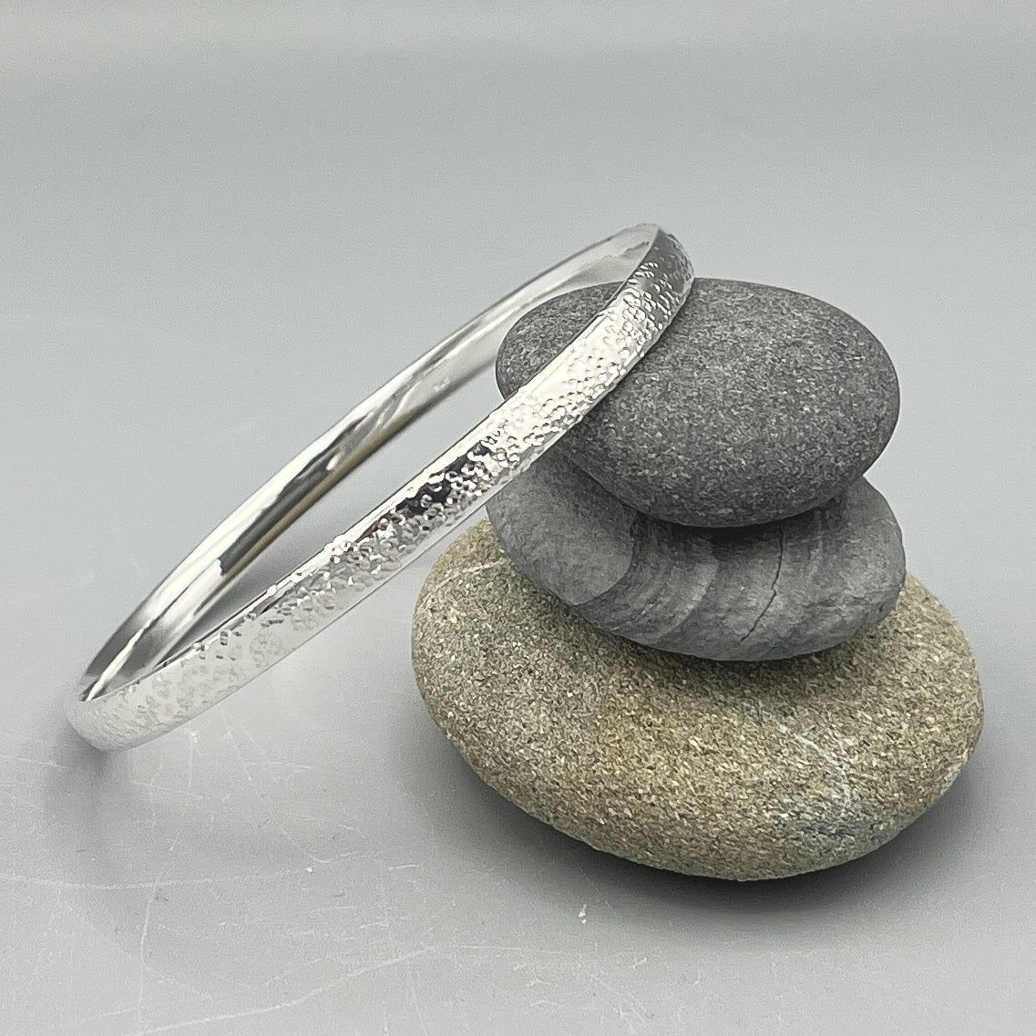 Sterling Silver Bangle. 'Star hammered' finish 70mm x 5.4mm x 2.3mm