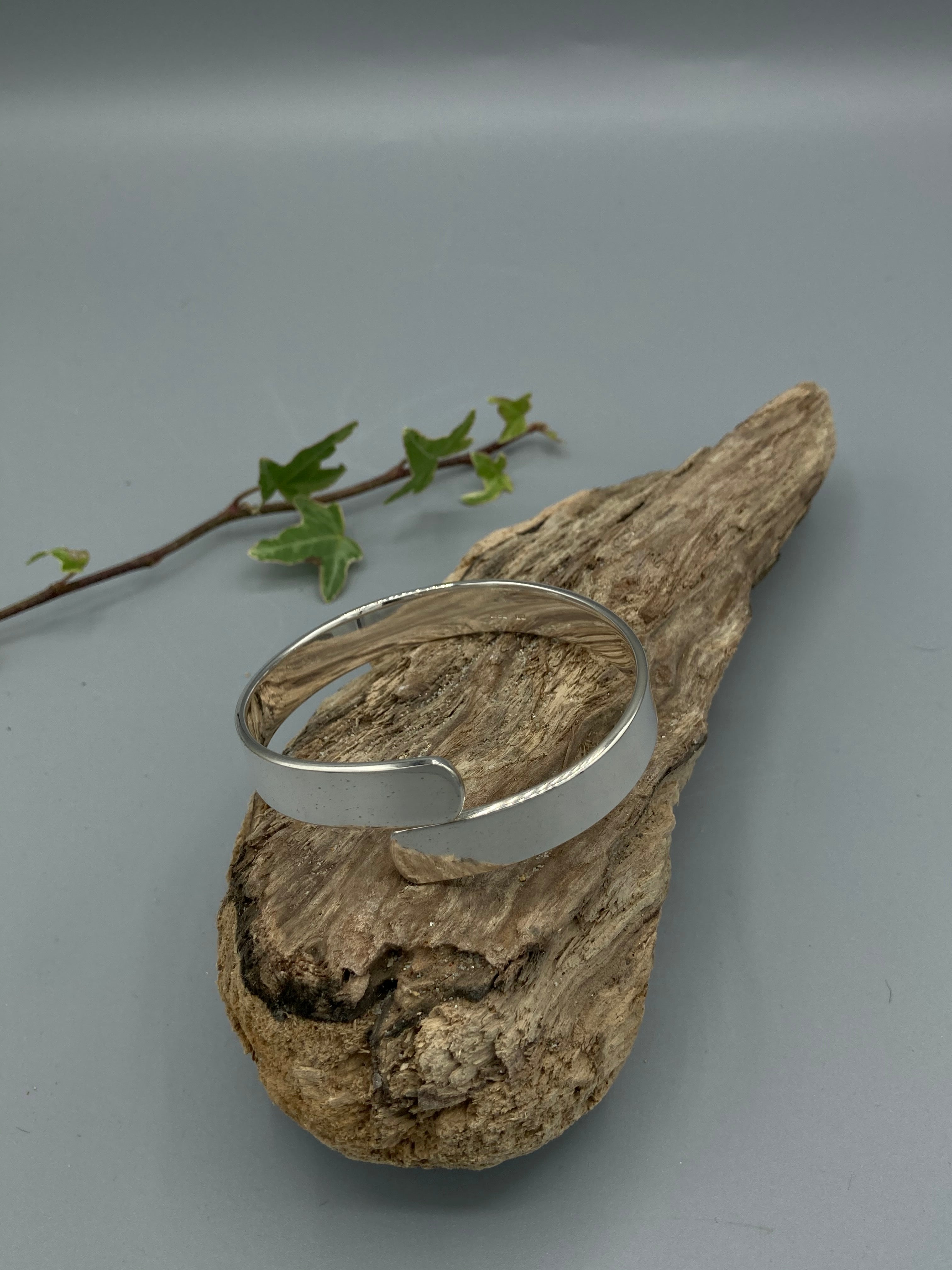 Sterling Silver Bangle, flat crossover with a polished finish