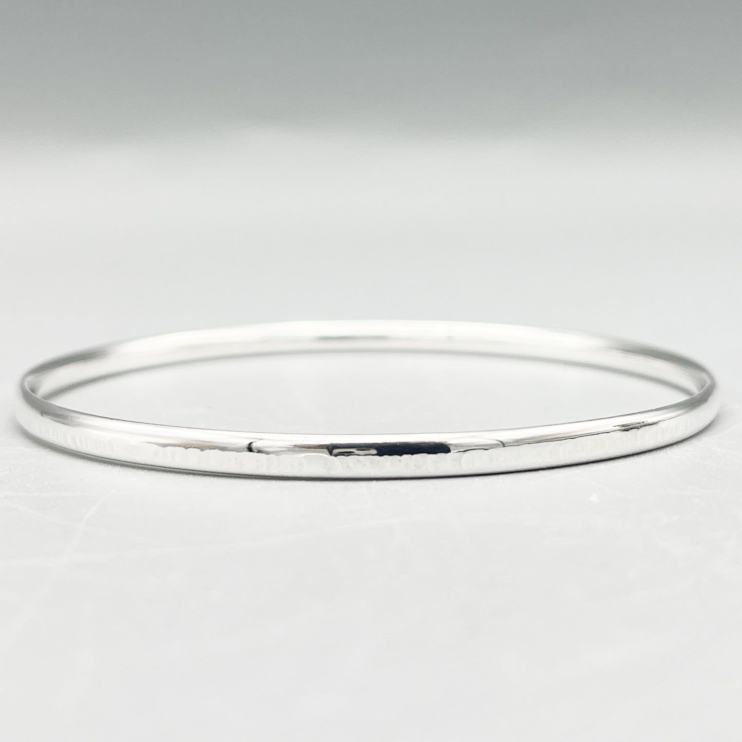 Sterling Silver Bangle, oval 'sunset' finish (3.5mm wide)