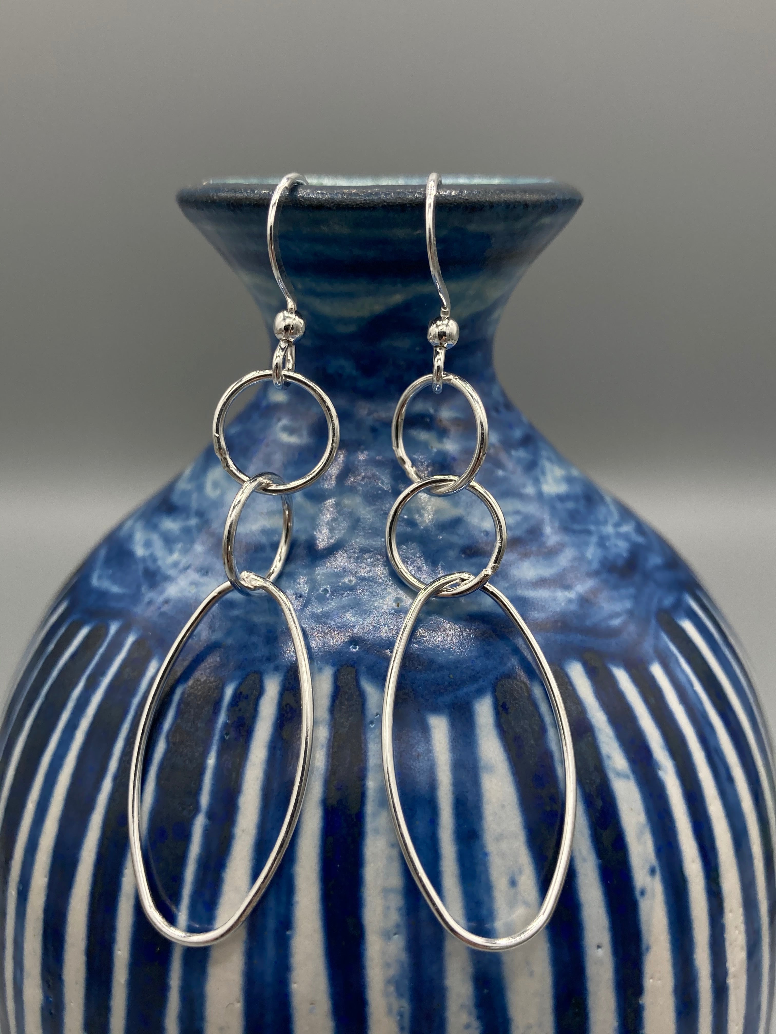 Sterling Silver three round and one oval wire fancy wire drop earrings