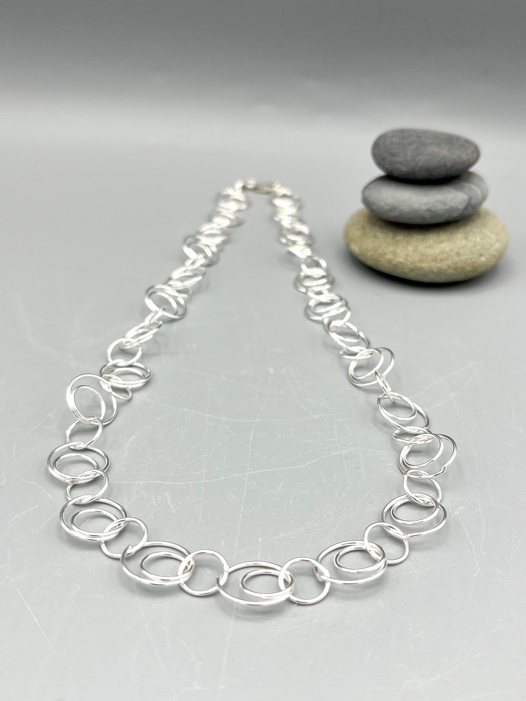 Sterling Silver Necklace. 21” long polished fancy round link necklace