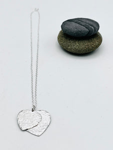 Double heart pendant 25mm & 20mm wide polished finish on 16" trace chain