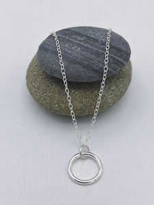 Sterling Silver single medium circle of life ring pendant polished finish on 16" trace chain