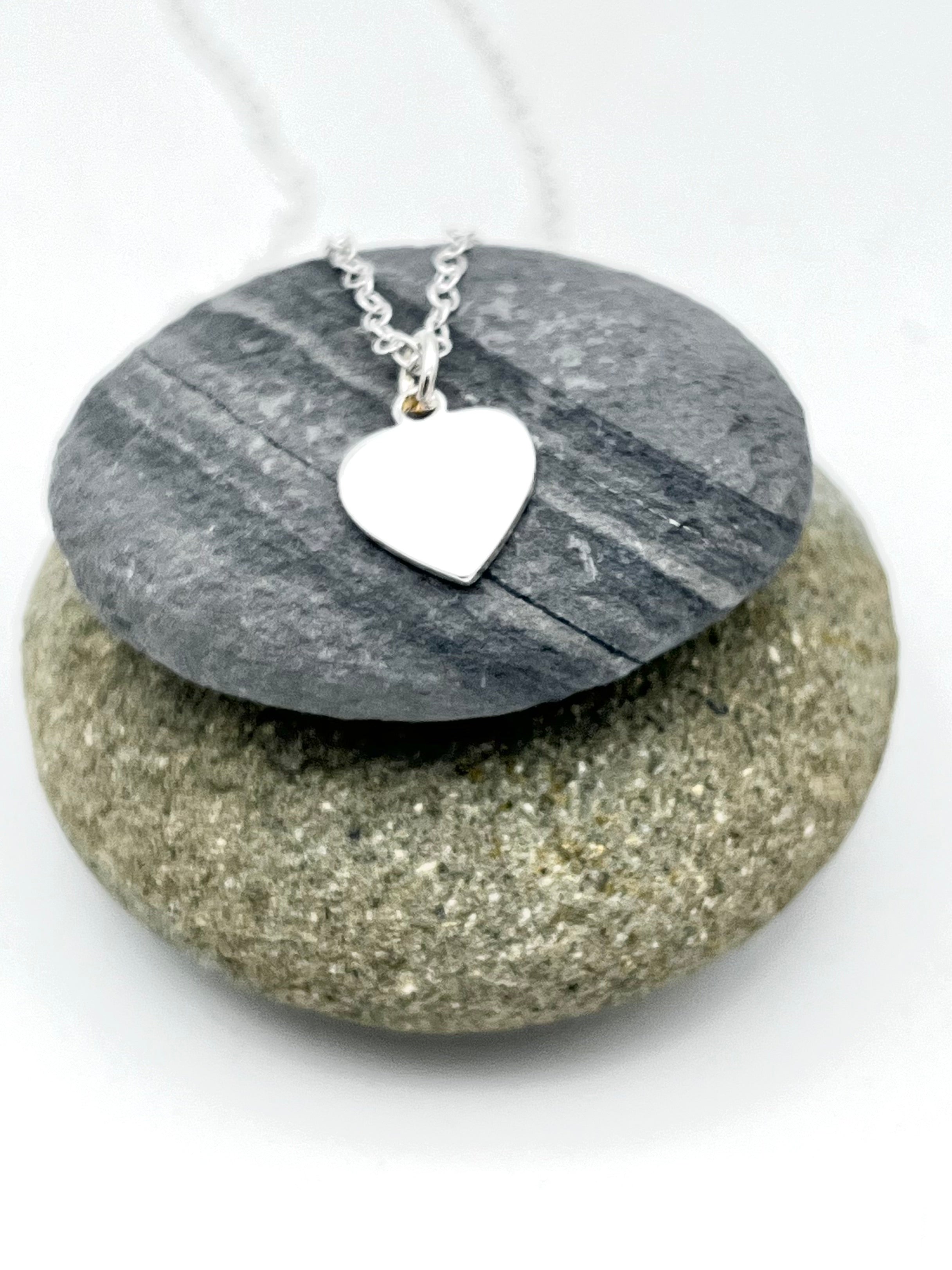 Heart pendant 10mm wide polished finish on 16" trace chain