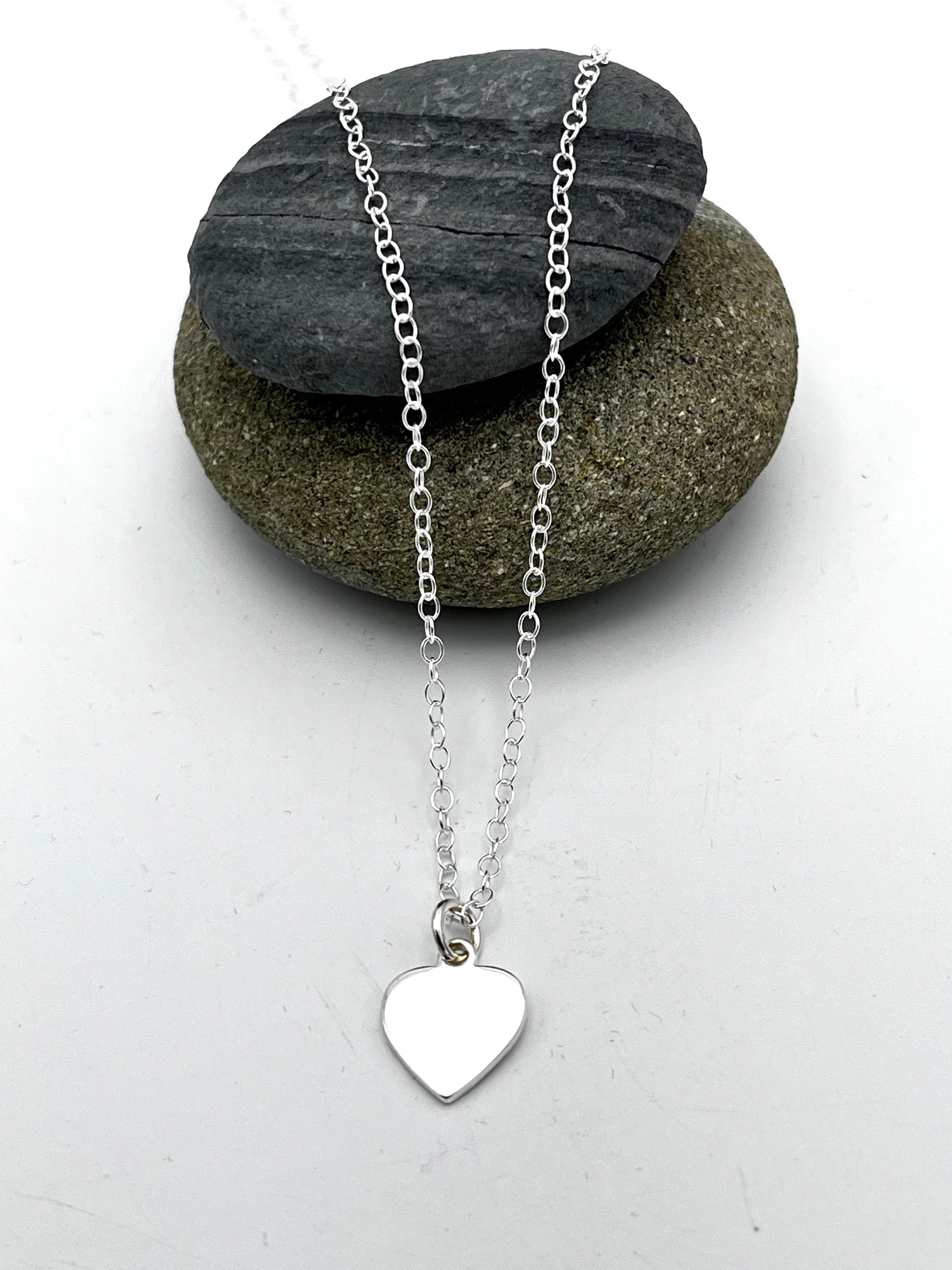 Heart pendant 10mm wide polished finish on 16" trace chain