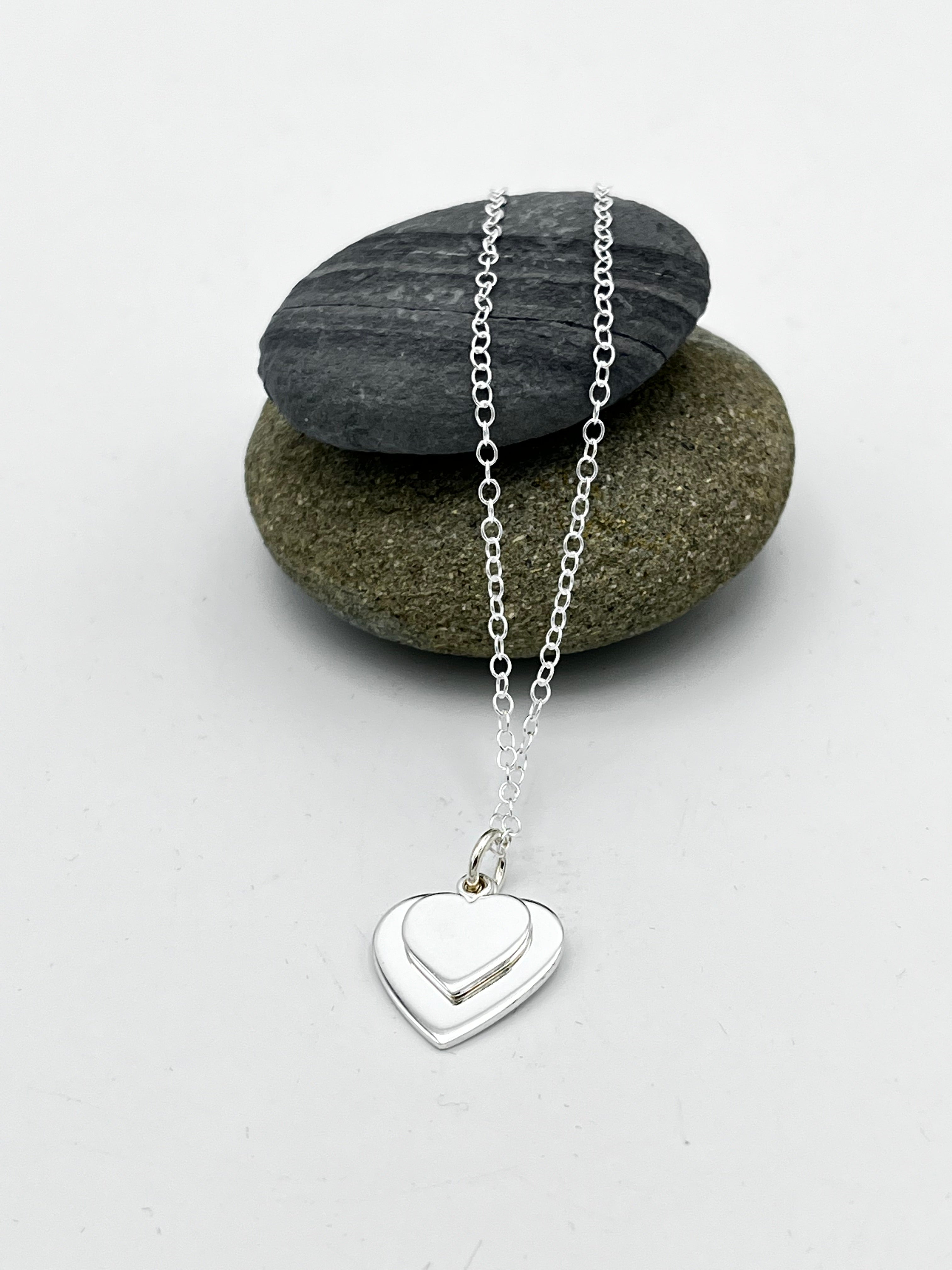 Double heart pendant 15mm & 10mm wide polished finish on 16" trace chain