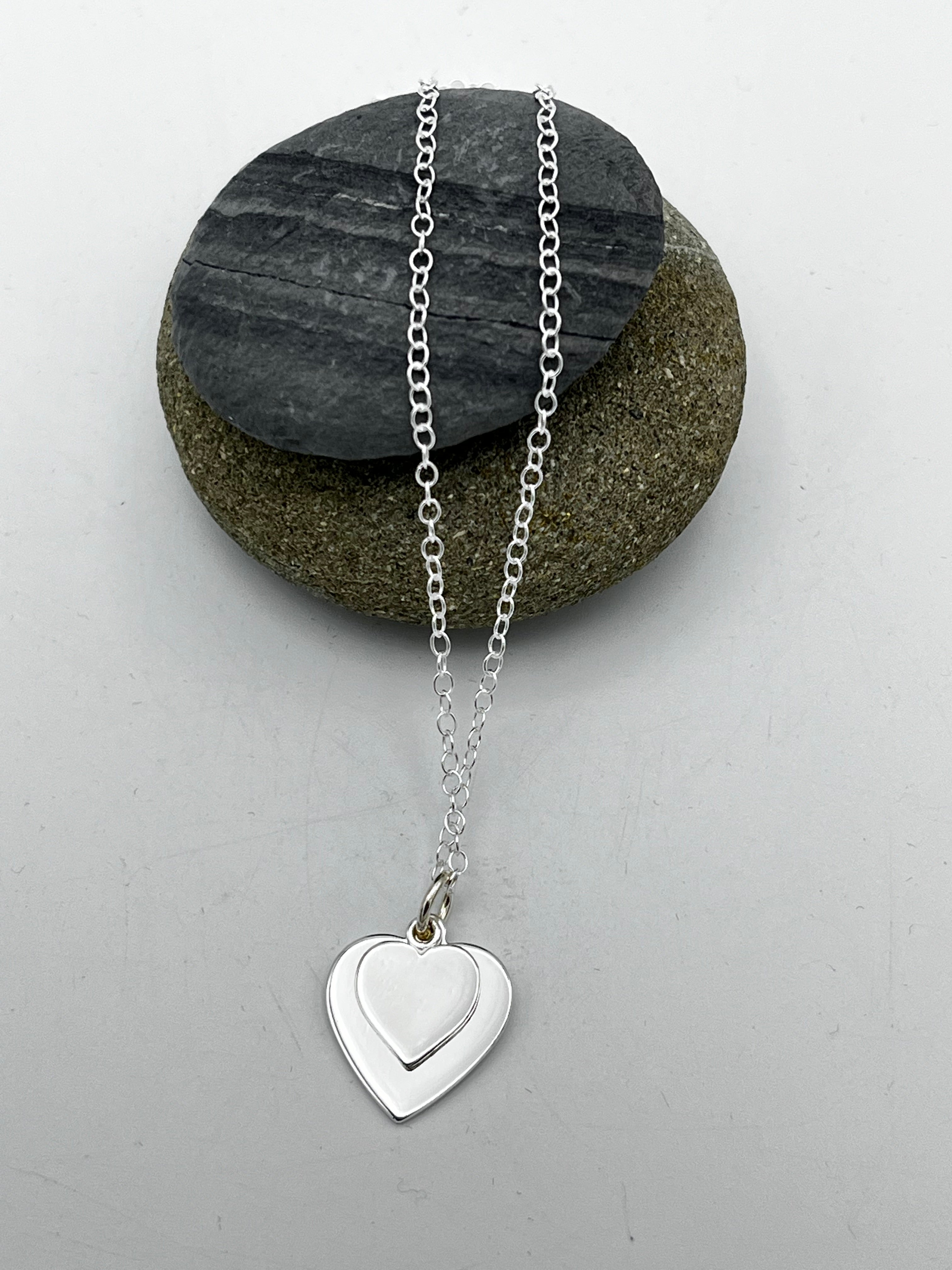 Double heart pendant 15mm & 10mm wide polished finish on 16" trace chain