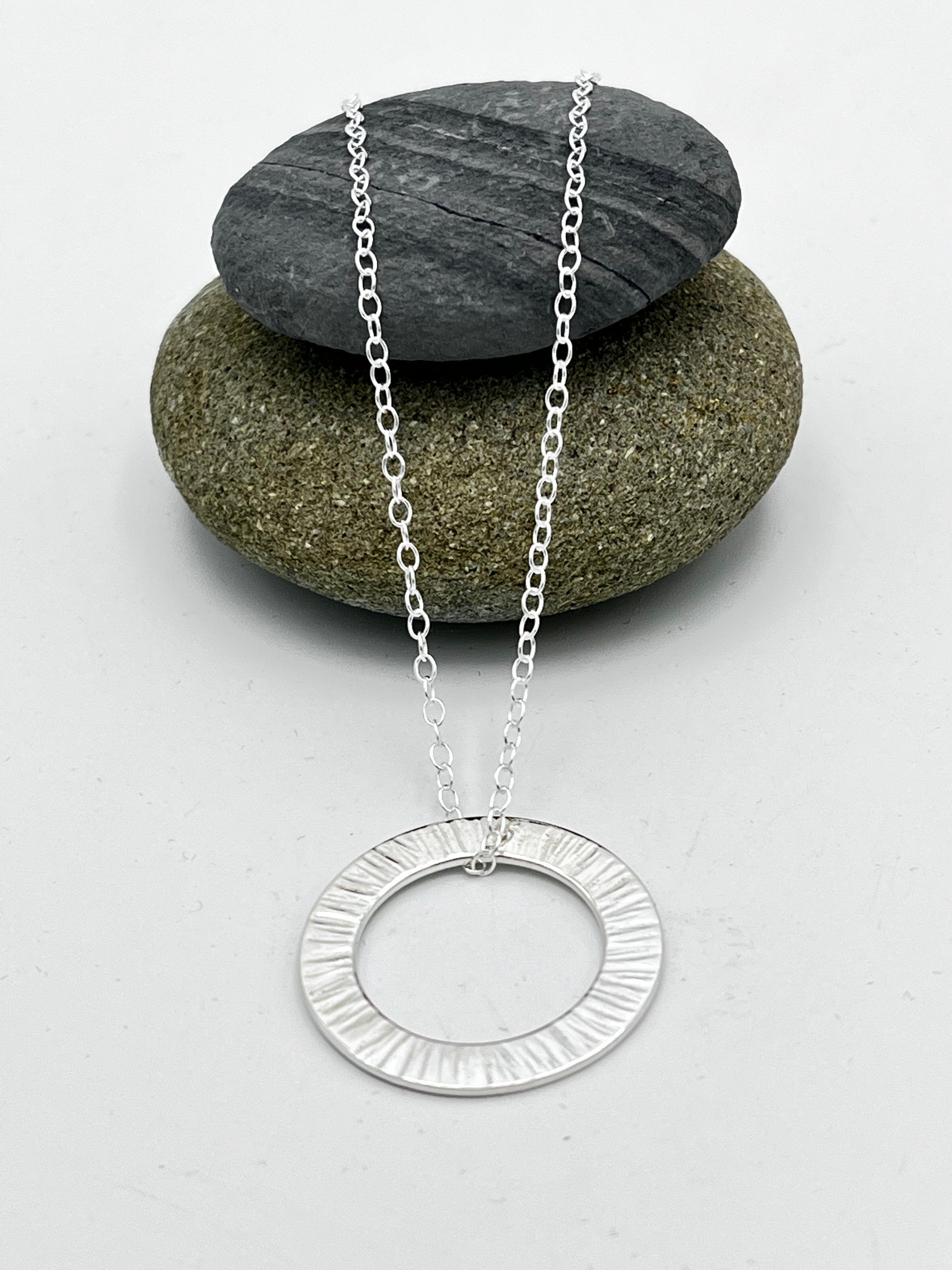 Washer pendant 25mm wide 'Sunset' finish on 16" trace chain