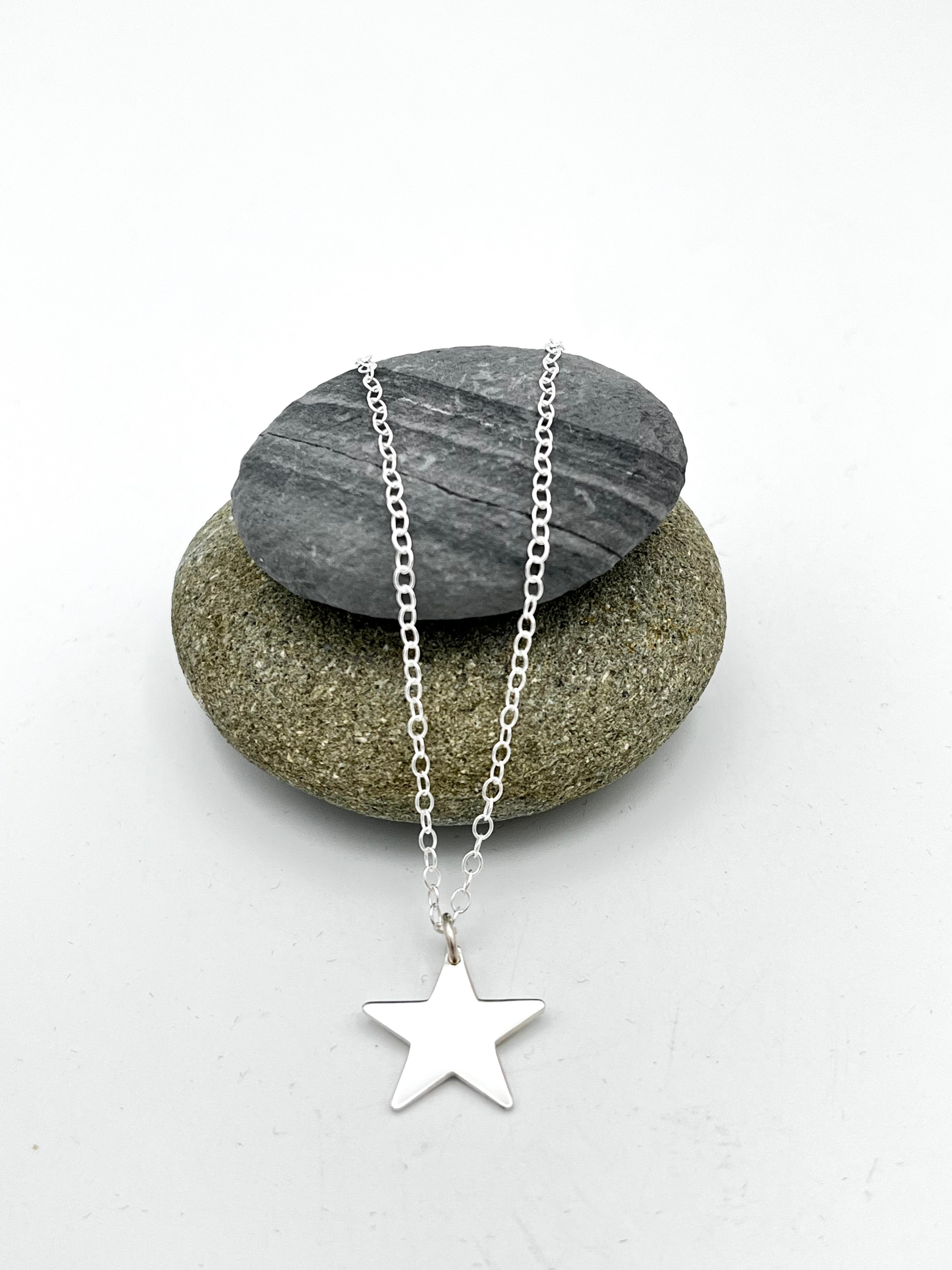 Single Star pendant 15mm wide polished finish on 16" chain
