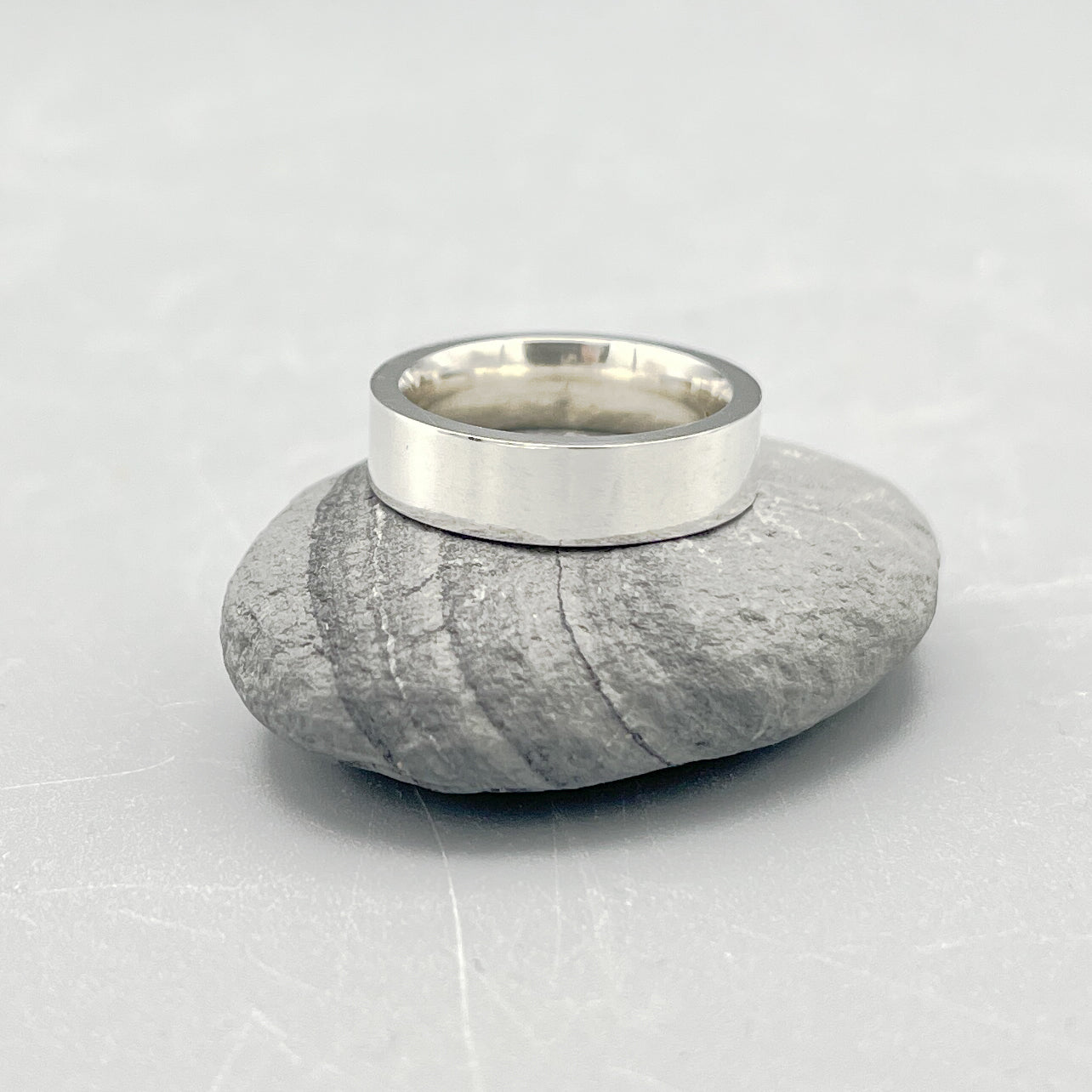 Sterling Silver Ring. Easy fit 5mm wide ring (rounded on the inside and flat on the outside) size 'K'